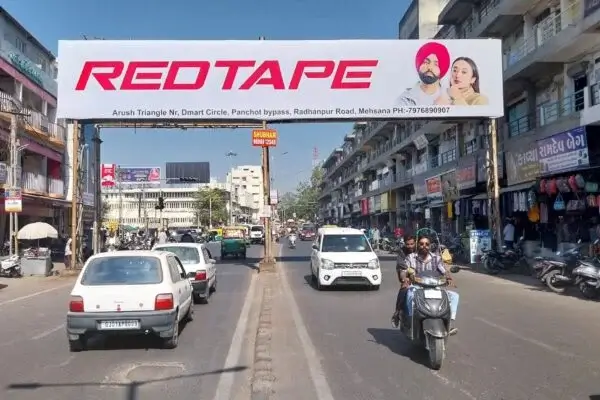 Gantry hoarding Advertising are large-scale, overhead advertisement boards placed across roads, flyovers, and highways.