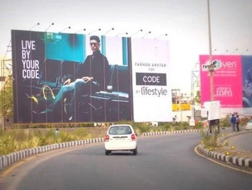 Highway hoardings aren't just big boards on the road. They are silent storytellers, reaching people where they're most focused—on the move.