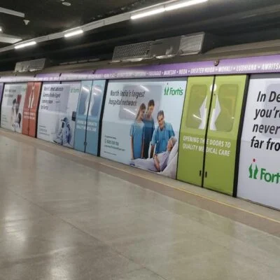 Fortis Hospital advertisement displayed on metro branding at underground station platform